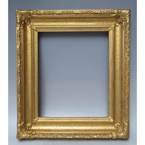 62 - A 19TH CENTURY DECORATIVE GOLD FRAME, with acanthus leaf design to edges and corner embellishments, ... 