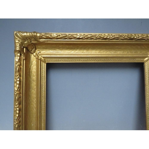 62 - A 19TH CENTURY DECORATIVE GOLD FRAME, with acanthus leaf design to edges and corner embellishments, ... 