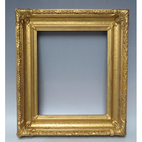 62 - A 19TH CENTURY DECORATIVE GOLD FRAME, with acanthus leaf design to edges and corner embellishments, ... 