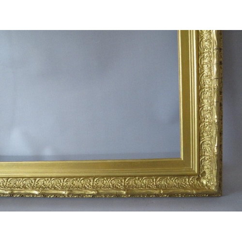 63 - A 19TH CENTURY DECORATIVE GOLD FRAME, with arched top integral slip, some restoration, frame W 8 cm,... 