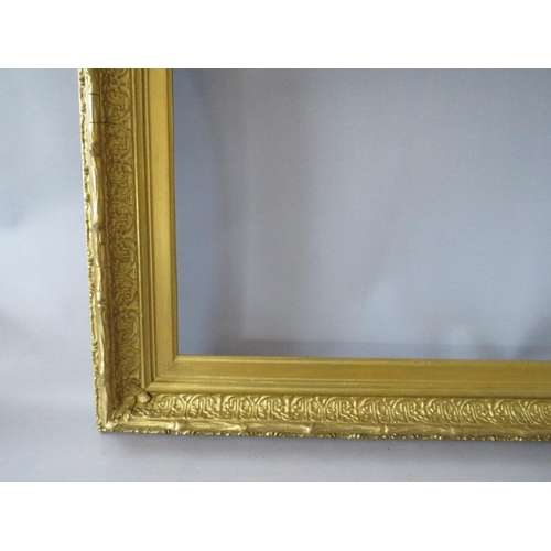 63 - A 19TH CENTURY DECORATIVE GOLD FRAME, with arched top integral slip, some restoration, frame W 8 cm,... 