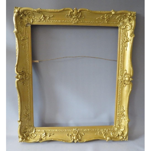 64 - A 19TH CENTURY GOLD SWEPT FRAME, with some restoration, frame W 8 cm, rebate 63 x 51 cm