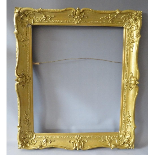 64 - A 19TH CENTURY GOLD SWEPT FRAME, with some restoration, frame W 8 cm, rebate 63 x 51 cm