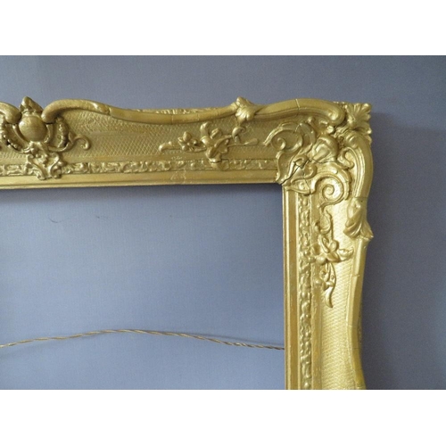 64 - A 19TH CENTURY GOLD SWEPT FRAME, with some restoration, frame W 8 cm, rebate 63 x 51 cm