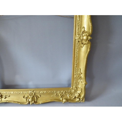 64 - A 19TH CENTURY GOLD SWEPT FRAME, with some restoration, frame W 8 cm, rebate 63 x 51 cm