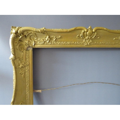 64 - A 19TH CENTURY GOLD SWEPT FRAME, with some restoration, frame W 8 cm, rebate 63 x 51 cm