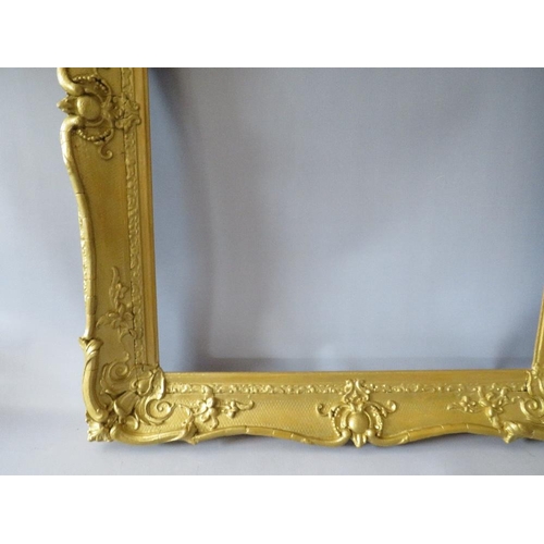 64 - A 19TH CENTURY GOLD SWEPT FRAME, with some restoration, frame W 8 cm, rebate 63 x 51 cm