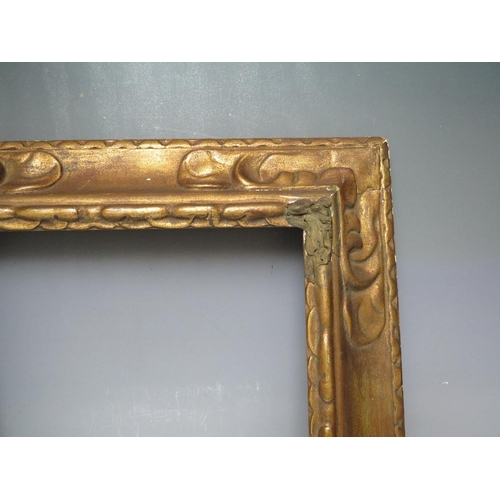66 - A LATE 19TH / EARLY 20TH CENTURY DECORATIVE GOLD FRAME, frame W 9 cm, rebate 43 x 35 cm