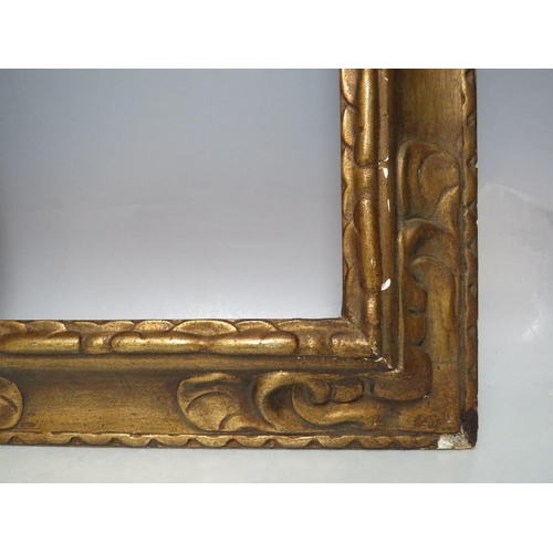 66 - A LATE 19TH / EARLY 20TH CENTURY DECORATIVE GOLD FRAME, frame W 9 cm, rebate 43 x 35 cm