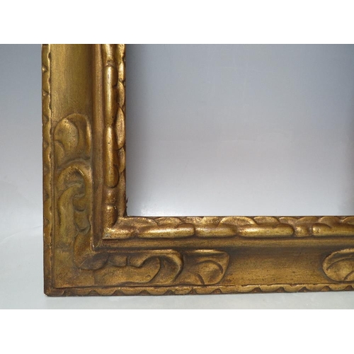 66 - A LATE 19TH / EARLY 20TH CENTURY DECORATIVE GOLD FRAME, frame W 9 cm, rebate 43 x 35 cm