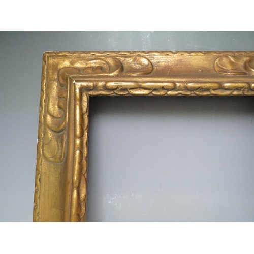 66 - A LATE 19TH / EARLY 20TH CENTURY DECORATIVE GOLD FRAME, frame W 9 cm, rebate 43 x 35 cm