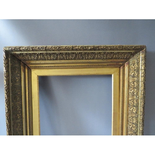 69 - A PAIR OF 19TH CENTURY DECORATIVE GOLD FRAMES, with acanthus leaf design to outer edge and gold slop... 