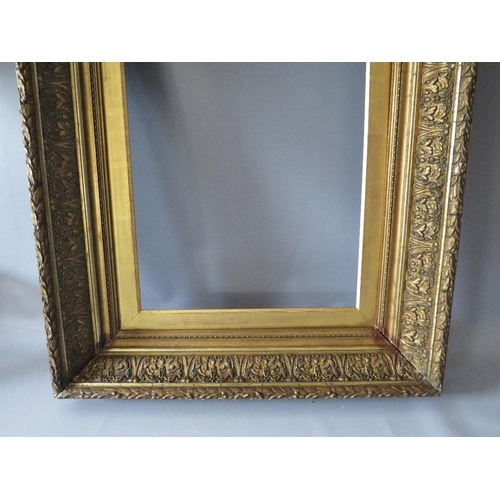 69 - A PAIR OF 19TH CENTURY DECORATIVE GOLD FRAMES, with acanthus leaf design to outer edge and gold slop... 