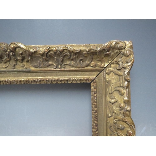 70 - A LATE 18TH / EARLY 19TH CENTURY CARVED WOODEN GOLD DECORATIVE FRAME, frame W 8 cm, rebate 34 x 24 c... 