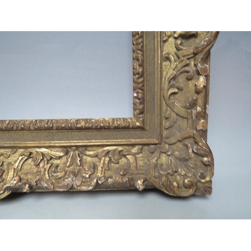 70 - A LATE 18TH / EARLY 19TH CENTURY CARVED WOODEN GOLD DECORATIVE FRAME, frame W 8 cm, rebate 34 x 24 c... 