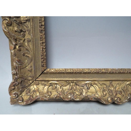 70 - A LATE 18TH / EARLY 19TH CENTURY CARVED WOODEN GOLD DECORATIVE FRAME, frame W 8 cm, rebate 34 x 24 c... 