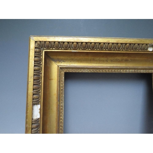 72 - A 19TH CENTURY GOLD FRAME WITH EGG AND DART DESIGN TO OUTER EDGE, frame W 9 cm, rebate 30 x 26 cm