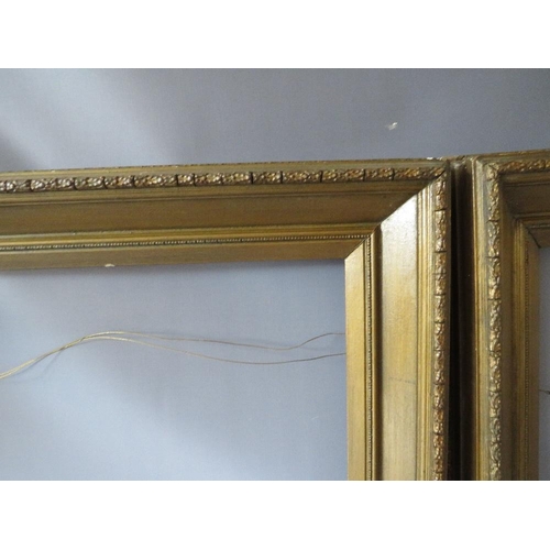 74 - A PAIR OF 19TH CENTURY GOLD FRAMES A/F, with decorative design to outer edge, frame W 11 cm, rebates... 
