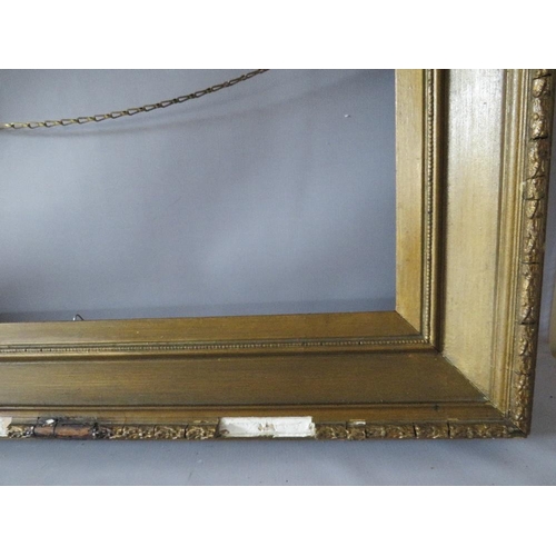 74 - A PAIR OF 19TH CENTURY GOLD FRAMES A/F, with decorative design to outer edge, frame W 11 cm, rebates... 
