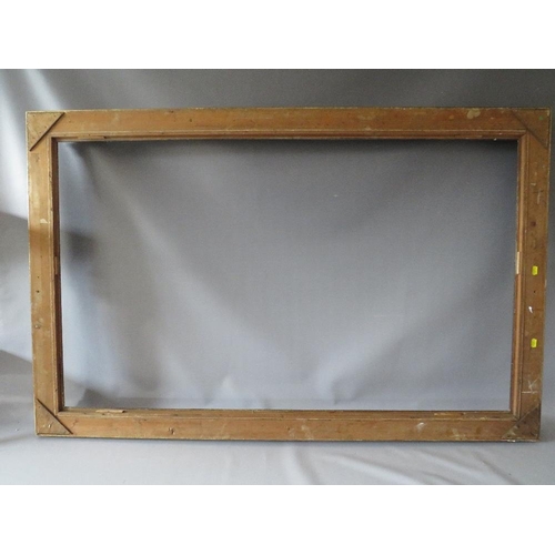 75 - A LATE 19TH / EARLY 20TH CENTURY DECORATIVE GOLD FRAME WITH WOODEN SLIP, frame W 7 cm, slip rebate 1... 
