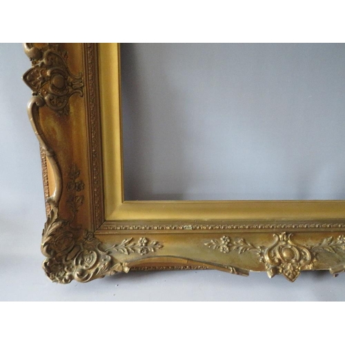 78 - A 19TH CENTURY DECORATIVE GOLD SWEPT FRAME WITH GOLD SLIP, frame W 10 cm, slip rebate 61 x 41 cm, fr... 