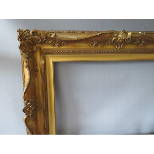 78 - A 19TH CENTURY DECORATIVE GOLD SWEPT FRAME WITH GOLD SLIP, frame W 10 cm, slip rebate 61 x 41 cm, fr... 