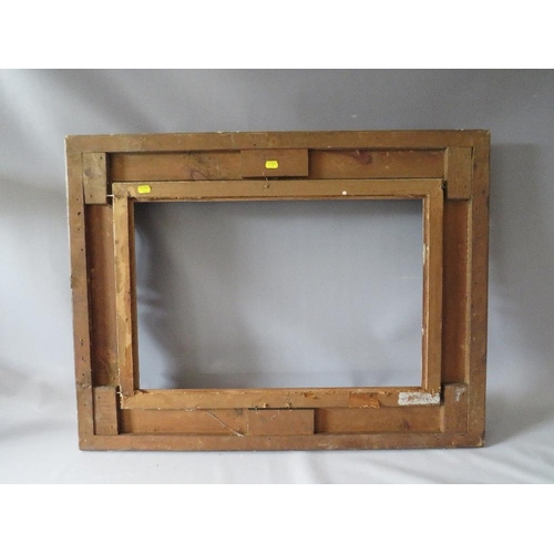 78 - A 19TH CENTURY DECORATIVE GOLD SWEPT FRAME WITH GOLD SLIP, frame W 10 cm, slip rebate 61 x 41 cm, fr... 