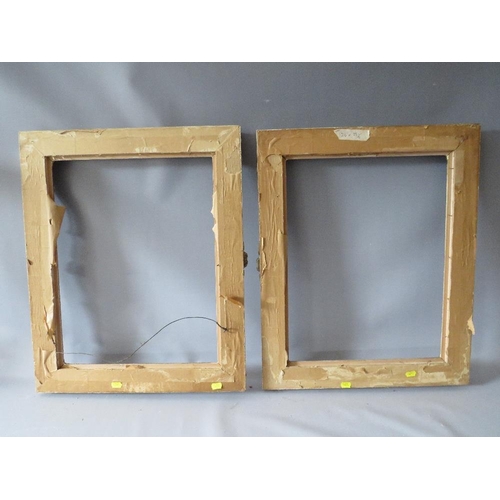 82 - A PAIR OF 20TH CENTURY DECORATIVE GILT SWEPT FRAMES, frame W 7 cm, rebate 51 x 39 cm