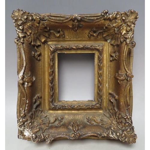 88 - A 19TH CENTURY GOLD SWEPT PORTRAIT MINIATURE FRAME, frame W 8 cm, rebate 11 x 9 cm