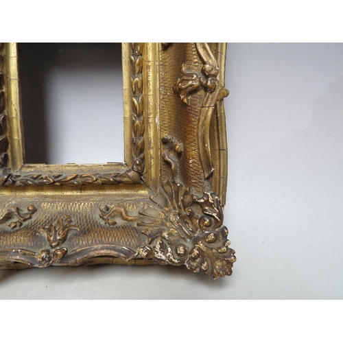 88 - A 19TH CENTURY GOLD SWEPT PORTRAIT MINIATURE FRAME, frame W 8 cm, rebate 11 x 9 cm