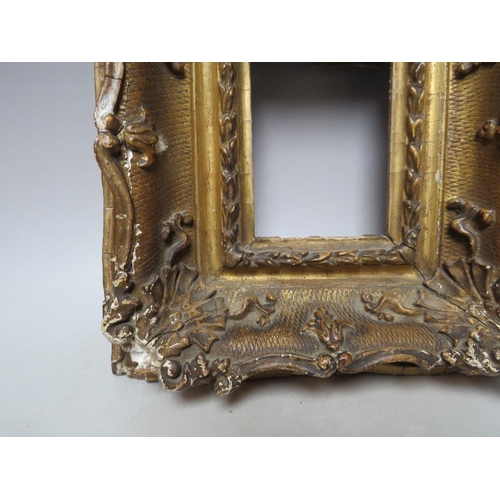 88 - A 19TH CENTURY GOLD SWEPT PORTRAIT MINIATURE FRAME, frame W 8 cm, rebate 11 x 9 cm