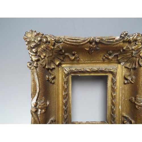 88 - A 19TH CENTURY GOLD SWEPT PORTRAIT MINIATURE FRAME, frame W 8 cm, rebate 11 x 9 cm