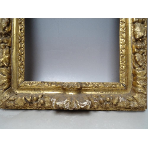 91 - A 17TH CENTURY CONTINENTAL DECORATIVE CARVED WOODEN FRAME WITH ARCHED TOP, frame W 7 cm, rebate 40 x... 