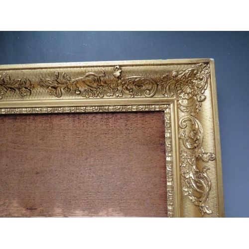 92 - AN 18TH CENTURY DECORATIVE GILT FRAME, frame W 8 cm, rebate 57 x 39 cm