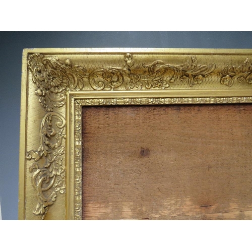 92 - AN 18TH CENTURY DECORATIVE GILT FRAME, frame W 8 cm, rebate 57 x 39 cm