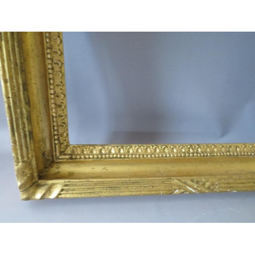 93 - AN 18TH CENTURY GILT FRAME WITH EGG AND DART DESIGN TO OUTER EDGE, frame W 7 cm, rebate 62 x 48 cm