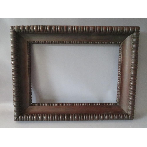 96 - A 19TH CENTURY DECORATIVE CARVED OAK FRAME, frame W 9 cm, rebate 54 x 37 cm