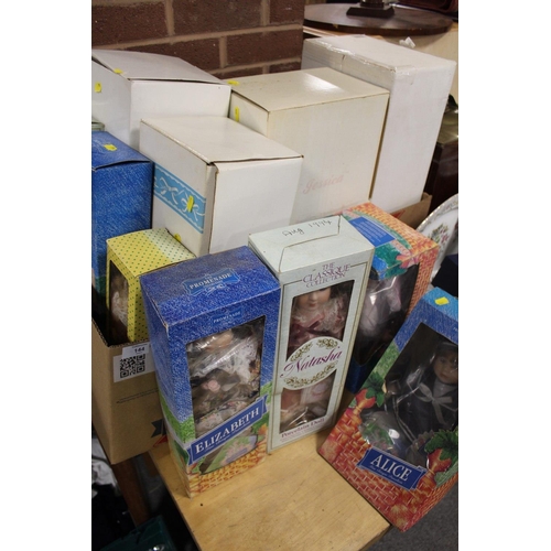 144 - A COLLECTION OF BOXED PORCELAIN HEADED DOLLS TO INCLUDE THE PROMENADE COLLECTION, THE CLASSIQUE COLL... 