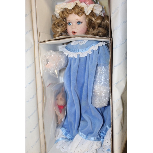 144 - A COLLECTION OF BOXED PORCELAIN HEADED DOLLS TO INCLUDE THE PROMENADE COLLECTION, THE CLASSIQUE COLL... 
