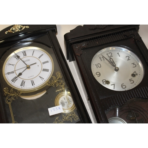 133A - TWO WALL CLOCKS, TO INCLUDE A PLASTIC EXAMPLE