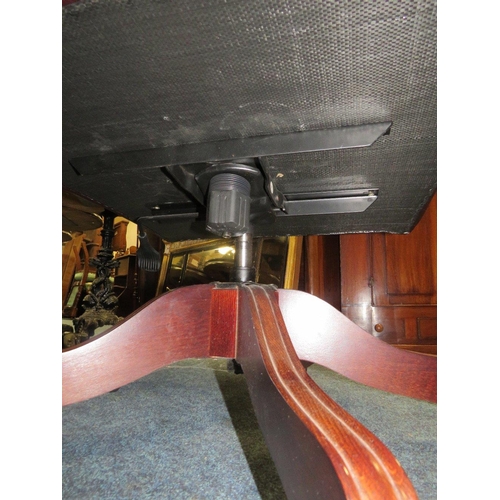 728 - AN OXBLOOD LEATHER OFFICE SWIVEL WINGBACK ARMCHAIR