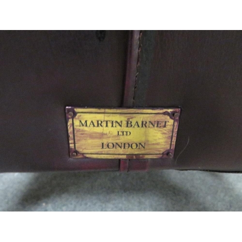 735 - AN OXBLOOD RED LEATHER WINGBACK ARMCHAIR BY MARTIN BARNES LONDON TOGETHER WITH A STOOL