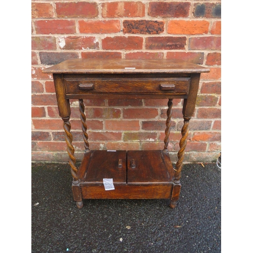 738 - A SMALL OAK BARLEYTWIST TABLE WITH UNUSUAL CUPBOARD BELOW