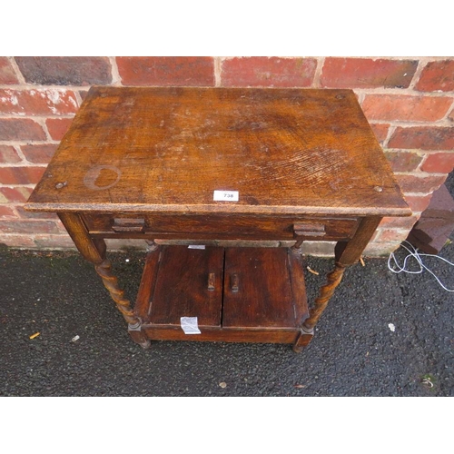 738 - A SMALL OAK BARLEYTWIST TABLE WITH UNUSUAL CUPBOARD BELOW