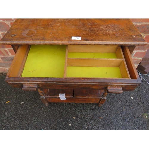 738 - A SMALL OAK BARLEYTWIST TABLE WITH UNUSUAL CUPBOARD BELOW