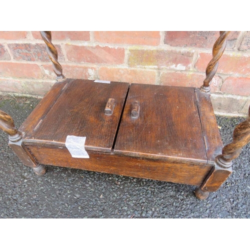 738 - A SMALL OAK BARLEYTWIST TABLE WITH UNUSUAL CUPBOARD BELOW