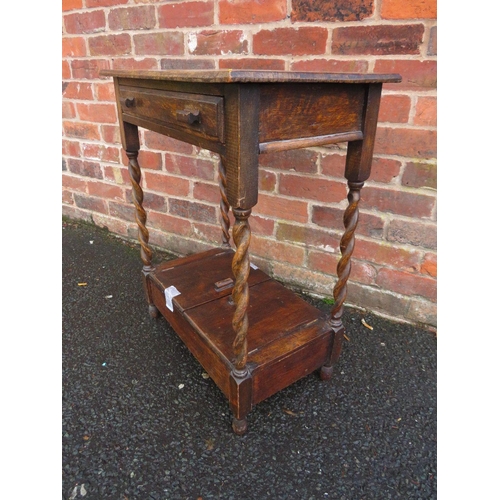 738 - A SMALL OAK BARLEYTWIST TABLE WITH UNUSUAL CUPBOARD BELOW