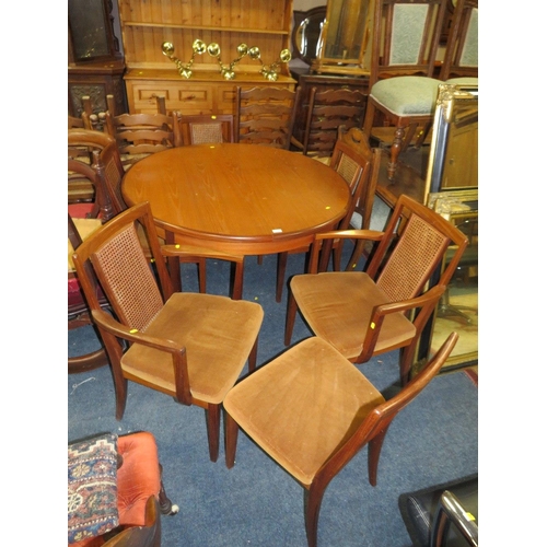 749 - A RETRO TEAK G-PLAN EXTENDING DINING TABLE WITH SIX CHAIRS