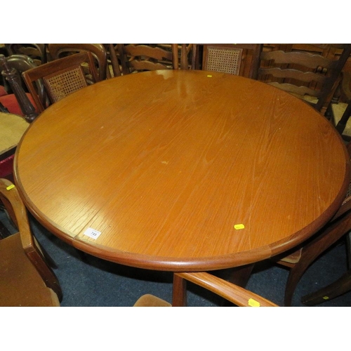 749 - A RETRO TEAK G-PLAN EXTENDING DINING TABLE WITH SIX CHAIRS