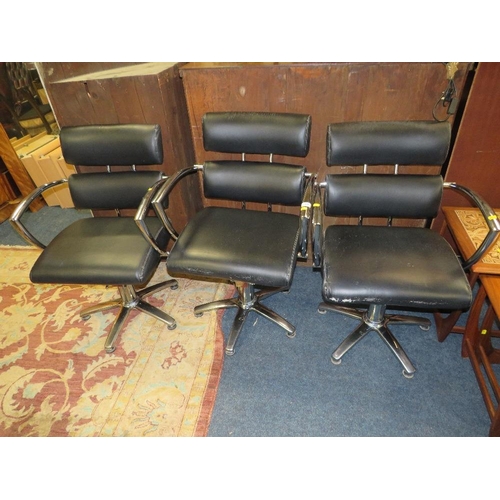 777 - THREE BLACK & CHROME SWIVEL ARMCHAIRS